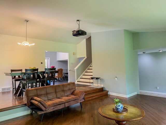 12533 S Iroquois Rd, Palos Park, IL 60464 - living room with wood finished floors, stairs, baseboards, and a chandelier