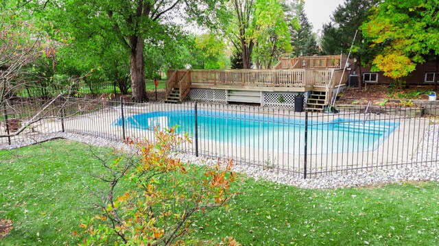 12533 S Iroquois Rd, Palos Park, IL 60464 - view of pool featuring a deck, stairs, and view of wooded area
