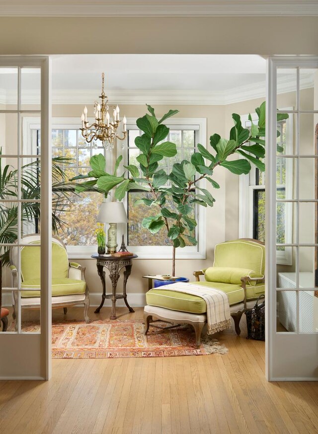 635 W Sheridan Rd Unit 3, Chicago, IL 60613 - living area with hardwood / wood-style floors, a chandelier, and crown molding