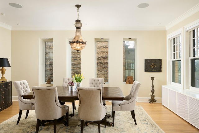 635 W Sheridan Rd Unit 3, Chicago, IL 60613 - dining room featuring light wood-type flooring, radiator heating unit, baseboards, and ornamental molding