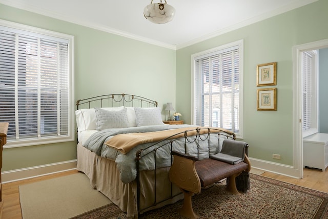 635 W Sheridan Rd Unit 3, Chicago, IL 60613 - bedroom featuring wood finished floors, ornamental molding, multiple windows, and baseboards