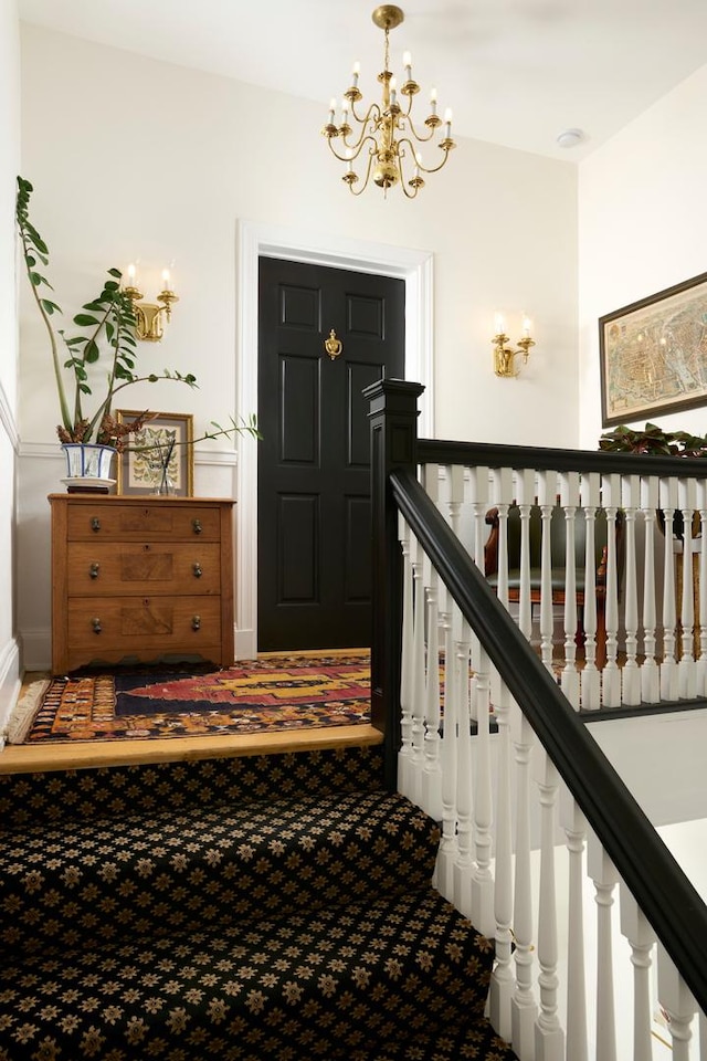 635 W Sheridan Rd Unit 3, Chicago, IL 60613 - staircase featuring a chandelier