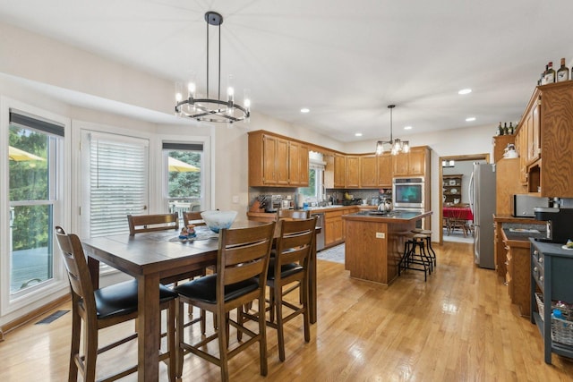 310 Westhaven Cir, Geneva, IL 60134 - dining area with a chandelier, light wood-style floors, plenty of natural light, and recessed lighting