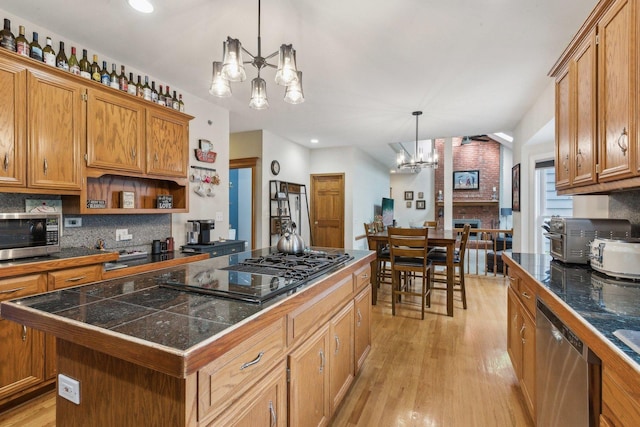 310 Westhaven Cir, Geneva, IL 60134 - kitchen with a chandelier, stainless steel appliances, tile countertops, a kitchen island, and recessed lighting