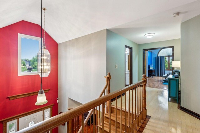 310 Westhaven Cir, Geneva, IL 60134 - corridor with an upstairs landing, wood finished floors, a chandelier, and lofted ceiling