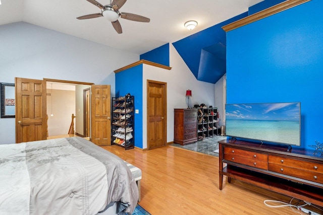 310 Westhaven Cir, Geneva, IL 60134 - bedroom with vaulted ceiling, wood finished floors, and a ceiling fan