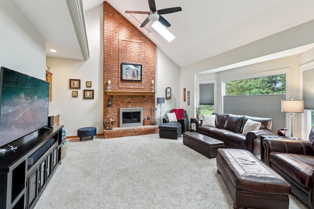 310 Westhaven Cir, Geneva, IL 60134 - carpeted living area with ceiling fan, high vaulted ceiling, a skylight, a fireplace, and baseboards