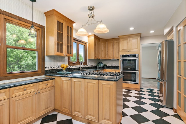 36 Shore Dr, Schaumburg, IL 60193 - kitchen featuring stainless steel appliances, light floors, a peninsula, glass insert cabinets, and recessed lighting