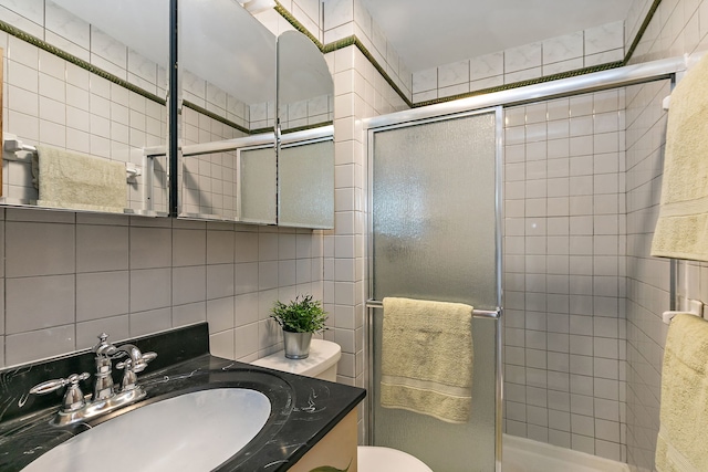 36 Shore Dr, Schaumburg, IL 60193 - full bath with tile walls, vanity, a shower stall, and toilet