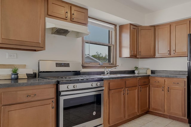 1970 E 170th St, South Holland, IL 60473 - kitchen featuring stainless steel range with gas stovetop, under cabinet range hood, a sink, dark countertops, and light tile patterned floors