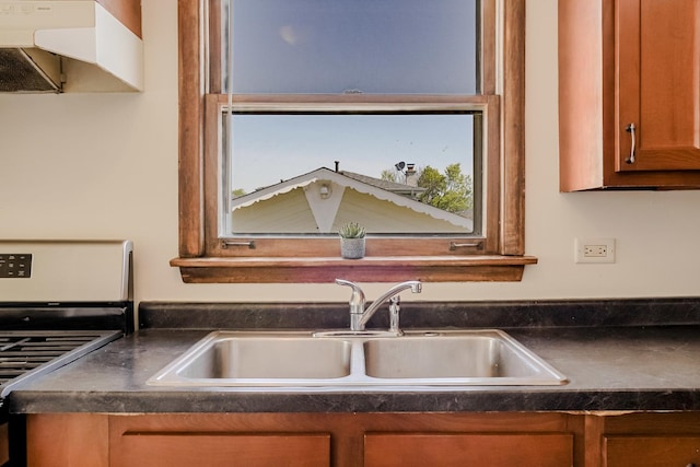 1970 E 170th St, South Holland, IL 60473 - kitchen with stainless steel gas range, a sink, dark countertops, and brown cabinetry