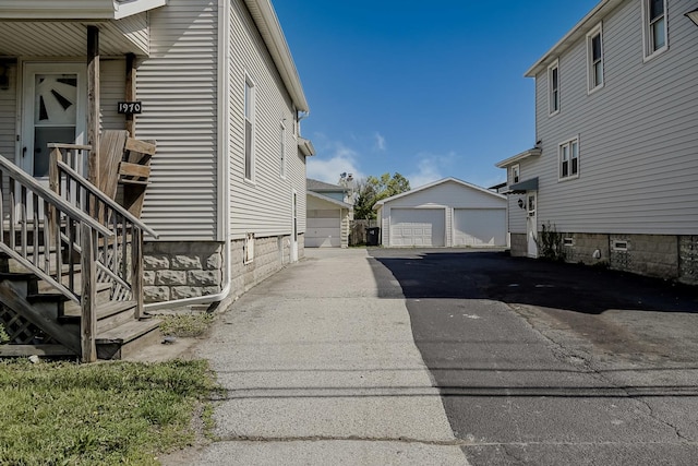 1970 E 170th St, South Holland, IL 60473 - view of home's exterior featuring a detached garage and an outdoor structure