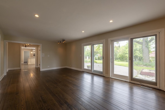 3745 Whirlaway Dr, Northbrook, IL 60062 - unfurnished living room featuring a chandelier, dark wood-type flooring, baseboards, and recessed lighting