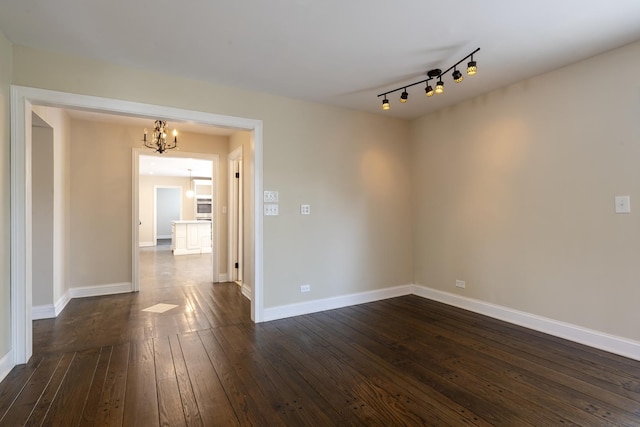 3745 Whirlaway Dr, Northbrook, IL 60062 - empty room with a chandelier, dark wood-style flooring, and baseboards