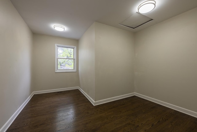 3745 Whirlaway Dr, Northbrook, IL 60062 - spare room featuring dark wood-type flooring, baseboards, and attic access