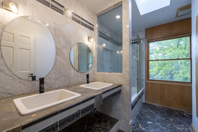 3745 Whirlaway Dr, Northbrook, IL 60062 - full bathroom featuring marble tiled flooring, a skylight, tile walls, and double vanity
