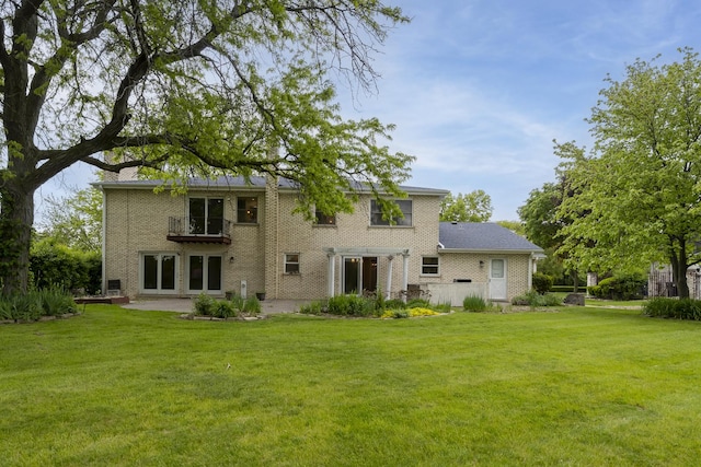 3745 Whirlaway Dr, Northbrook, IL 60062 - back of property with a lawn, brick siding, and a patio area