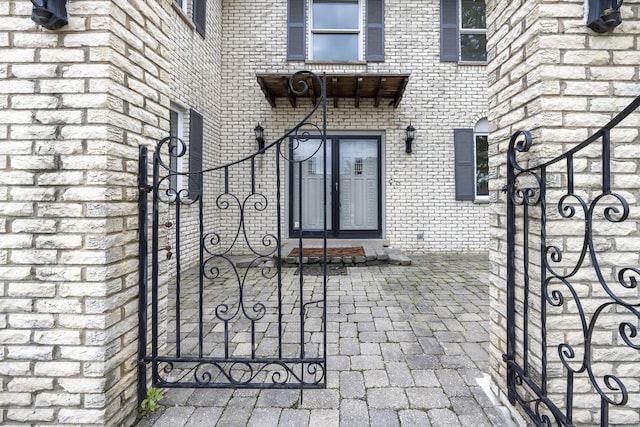 3745 Whirlaway Dr, Northbrook, IL 60062 - property entrance featuring brick siding and a gate