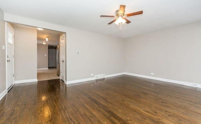 9032 S University Ave, Chicago, IL 60619 - unfurnished room featuring dark wood finished floors, ceiling fan, and baseboards