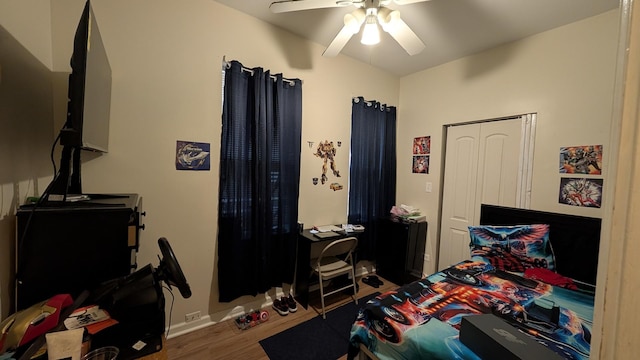 2160 S Millard Ave, Chicago, IL 60623 - bedroom featuring wood finished floors, a ceiling fan, and baseboards