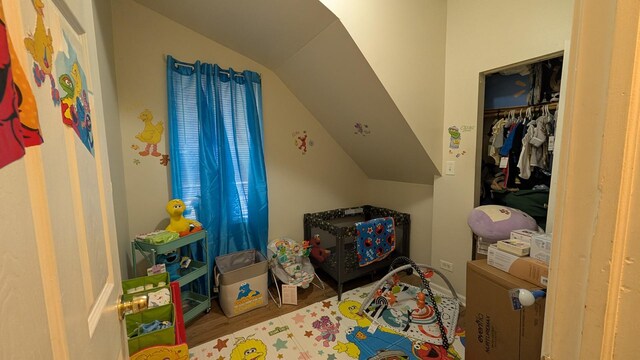 2160 S Millard Ave, Chicago, IL 60623 - bedroom featuring lofted ceiling, wood finished floors, and a closet