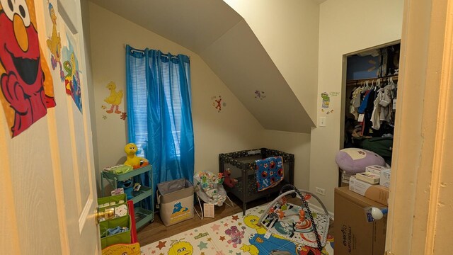 2160 S Millard Ave, Chicago, IL 60623 - bedroom featuring lofted ceiling, wood finished floors, and a closet