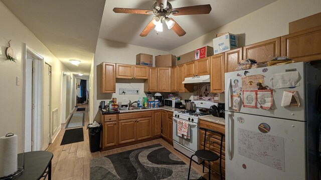 2160 S Millard Ave, Chicago, IL 60623 - kitchen featuring white appliances, under cabinet range hood, a sink, ceiling fan, and light wood finished floors