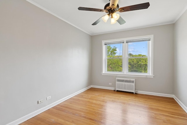 524 Michigan Ave Unit 3N, Evanston, IL 60202 - unfurnished room featuring radiator, light wood-style flooring, baseboards, ornamental molding, and ceiling fan
