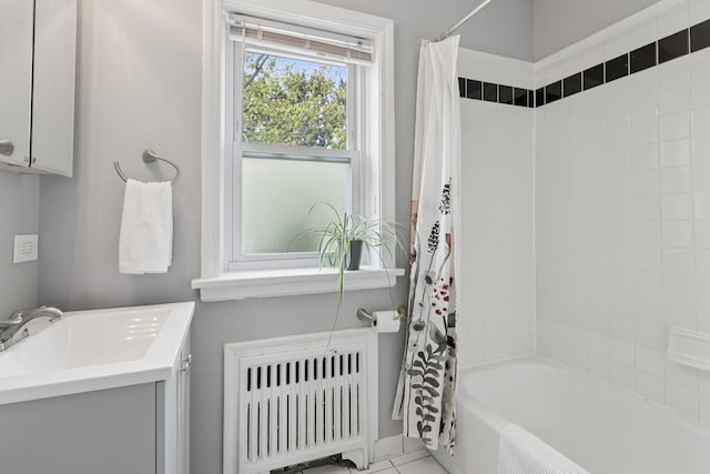 524 Michigan Ave Unit 3N, Evanston, IL 60202 - bathroom with radiator, shower / bathtub combination with curtain, vanity, and tile patterned flooring
