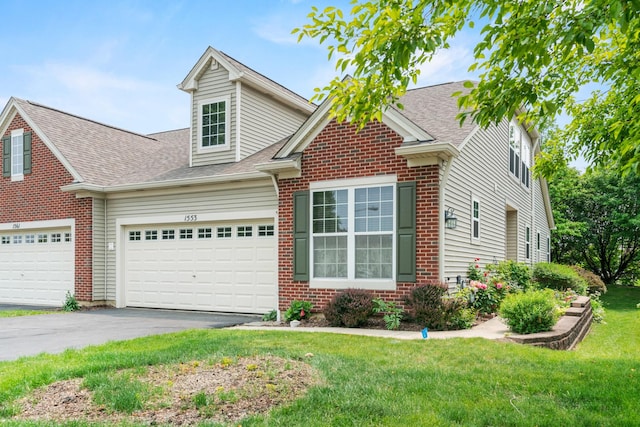 1553 Catalina Ln, Aurora, IL 60504 - traditional-style house with brick siding, a front lawn, roof with shingles, driveway, and an attached garage