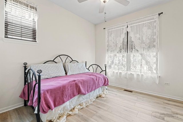 1553 Catalina Ln, Aurora, IL 60504 - bedroom with wood finished floors, baseboards, and a ceiling fan