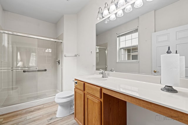 1553 Catalina Ln, Aurora, IL 60504 - full bathroom featuring wood finished floors, toilet, a shower stall, and vanity