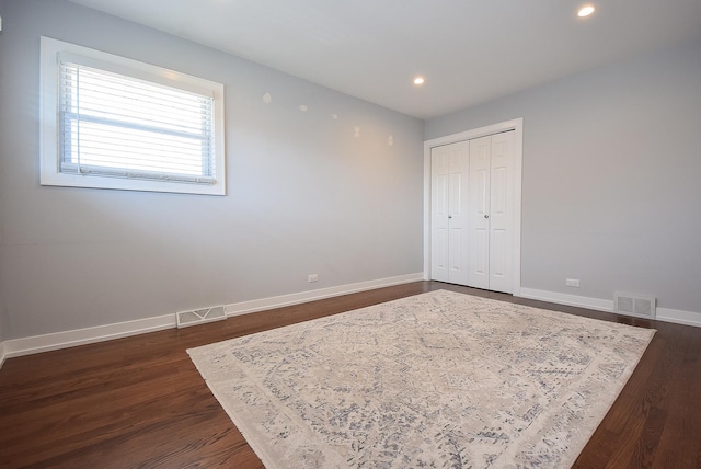 2726 Sarah St, Franklin Park, IL 60131 - unfurnished bedroom featuring recessed lighting, baseboards, dark wood-type flooring, and a closet
