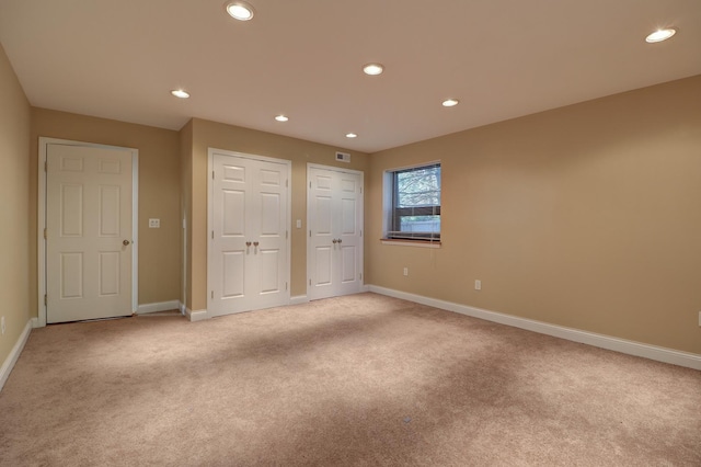 701A Hill Dr, Rock Falls, IL 61071 - unfurnished bedroom featuring light carpet, baseboards, and recessed lighting