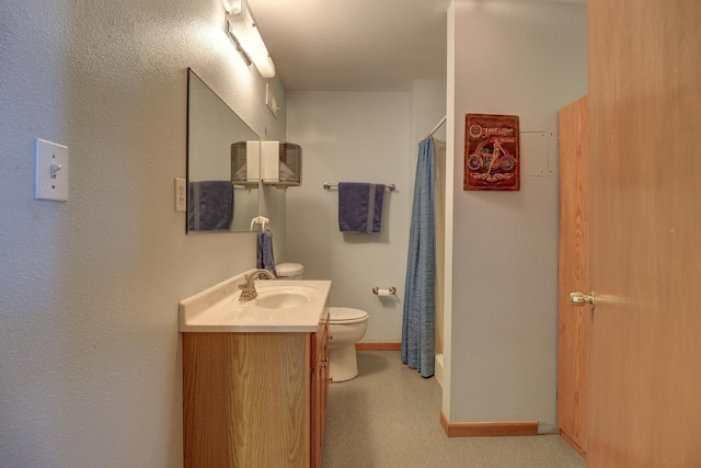 701A Hill Dr, Rock Falls, IL 61071 - full bathroom featuring vanity, toilet, baseboards, and curtained shower
