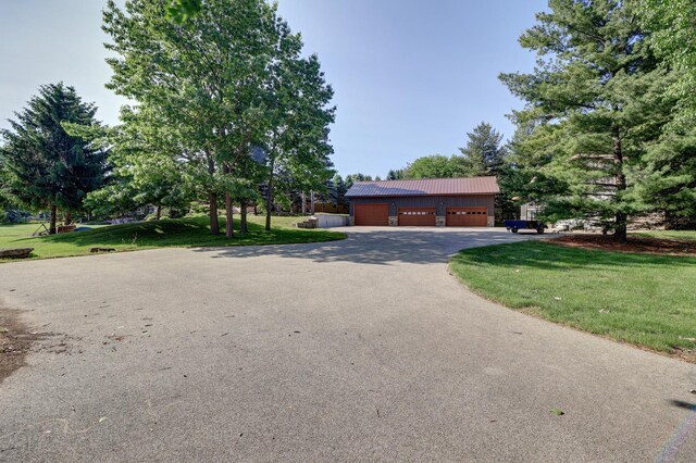 701A Hill Dr, Rock Falls, IL 61071 - view of front of home with a front yard, asphalt driveway, and metal roof