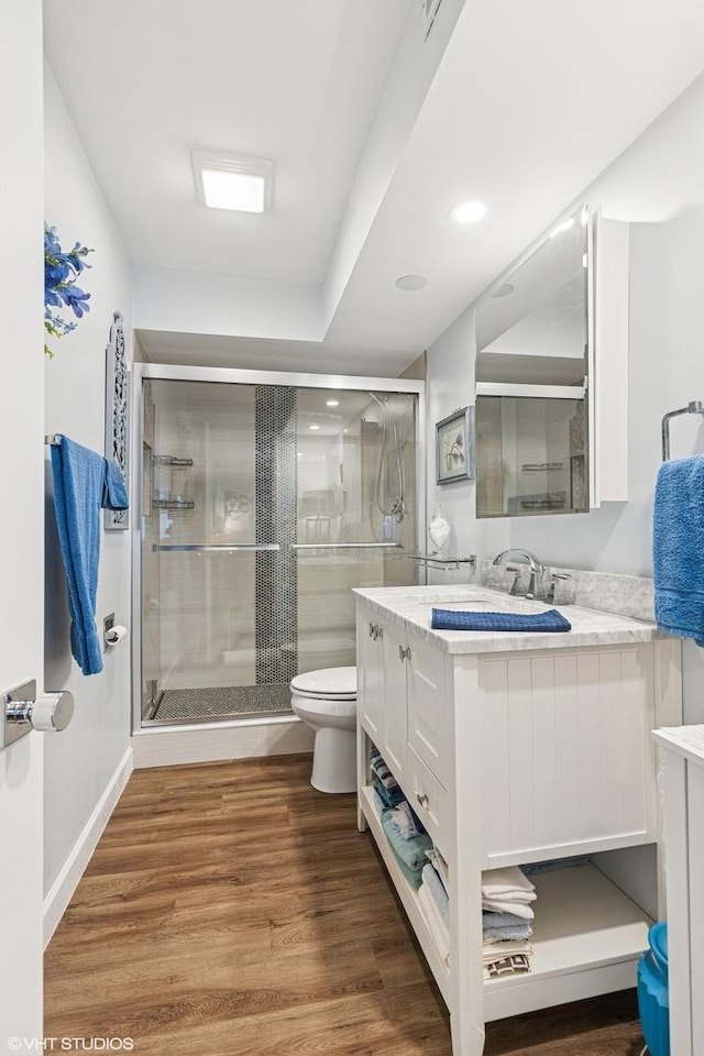 445 N Park Blvd Unit 3D, Glen Ellyn, IL 60137 - full bath featuring vanity, toilet, a stall shower, wood finished floors, and recessed lighting