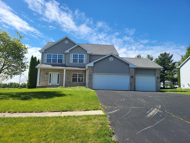383 Prairie Knoll Dr, Poplar Grove, IL 61065 - view of front of property featuring driveway, a garage, and a front lawn