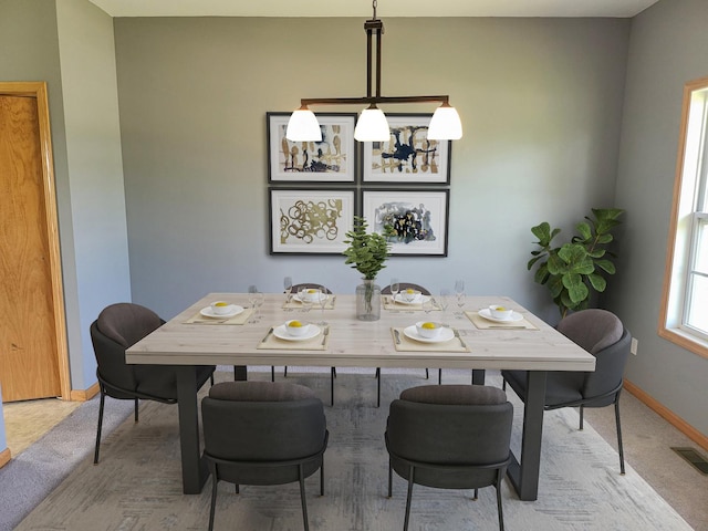 383 Prairie Knoll Dr, Poplar Grove, IL 61065 - dining space with light colored carpet and a chandelier
