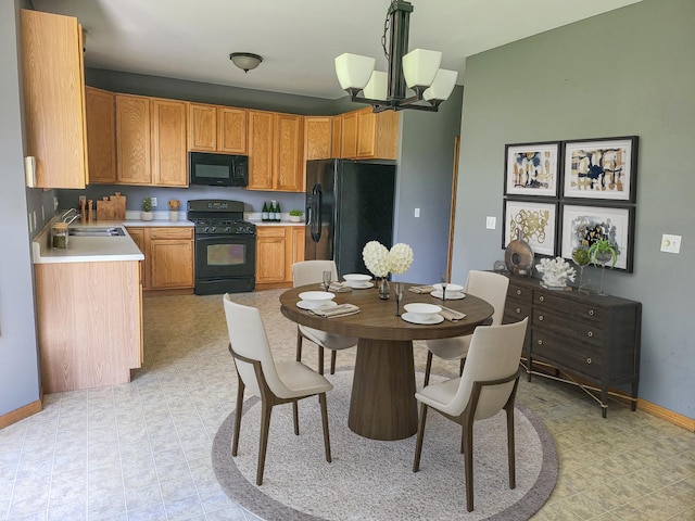 383 Prairie Knoll Dr, Poplar Grove, IL 61065 - kitchen featuring black appliances, a chandelier, and light countertops