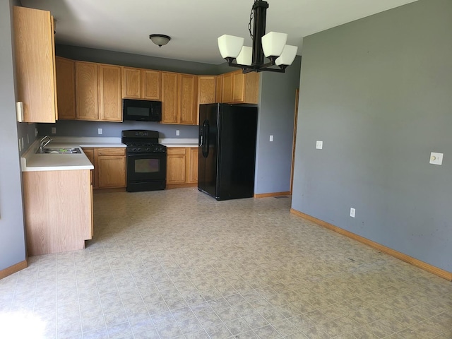 383 Prairie Knoll Dr, Poplar Grove, IL 61065 - kitchen featuring black appliances, a chandelier, a sink, baseboards, and light countertops