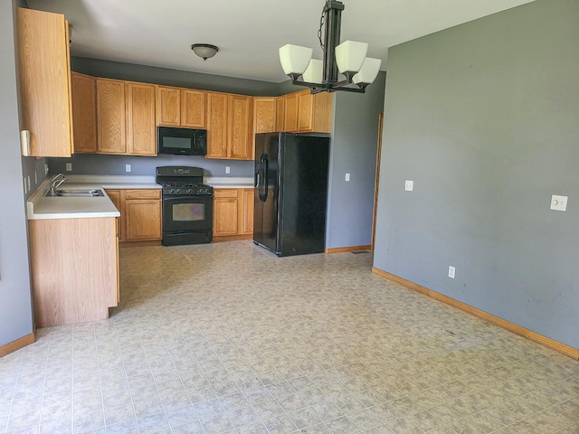 383 Prairie Knoll Dr, Poplar Grove, IL 61065 - kitchen with black appliances, a chandelier, and light countertops