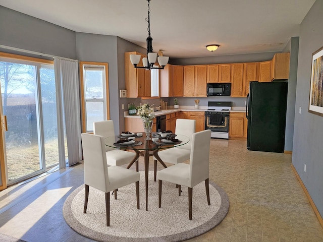 383 Prairie Knoll Dr, Poplar Grove, IL 61065 - dining area featuring a chandelier, baseboards, and light flooring
