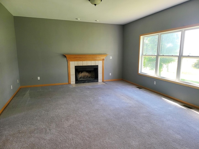 383 Prairie Knoll Dr, Poplar Grove, IL 61065 - unfurnished living room with a tile fireplace and carpet