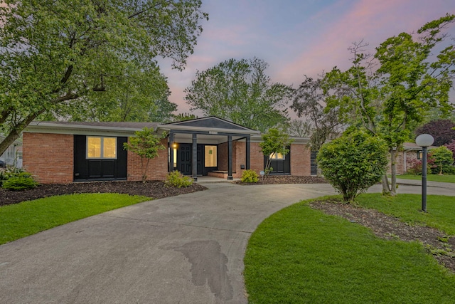 18908 E Louise Dr, Lansing, IL 60438 - view of front of property with a front lawn, brick siding, and a porch