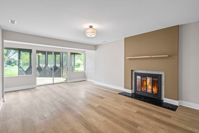 18908 E Louise Dr, Lansing, IL 60438 - unfurnished living room with wood finished floors, baseboards, and a high end fireplace