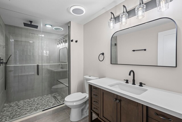 18908 E Louise Dr, Lansing, IL 60438 - full bathroom featuring toilet, vanity, a shower stall, and tile patterned floors