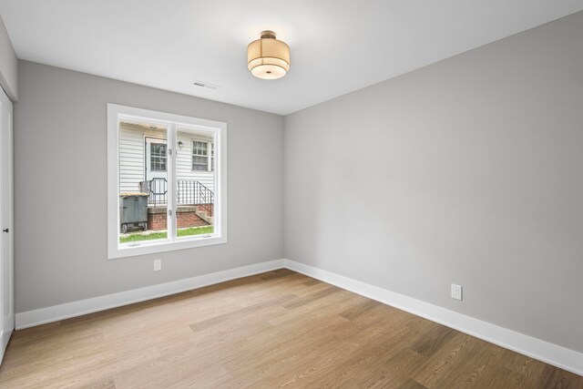18908 E Louise Dr, Lansing, IL 60438 - unfurnished room with light wood-type flooring and baseboards