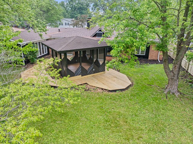 18908 E Louise Dr, Lansing, IL 60438 - rear view of property featuring a shingled roof, a lawn, a wooden deck, and brick siding