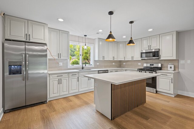 18908 E Louise Dr, Lansing, IL 60438 - kitchen with appliances with stainless steel finishes, a sink, light wood-type flooring, light countertops, and recessed lighting